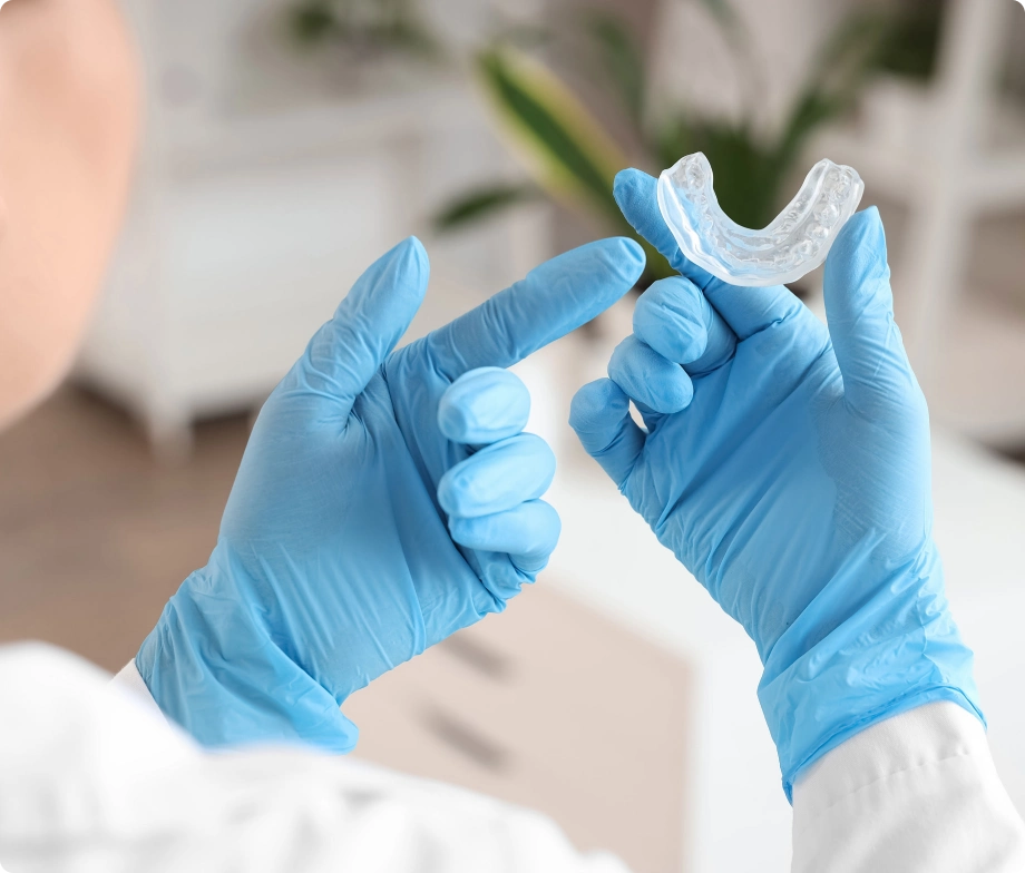 Dentist holding mouthguard