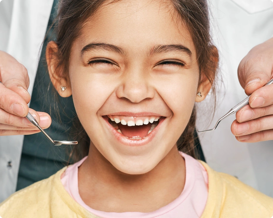 Young girl smiling at dental clinic calgary